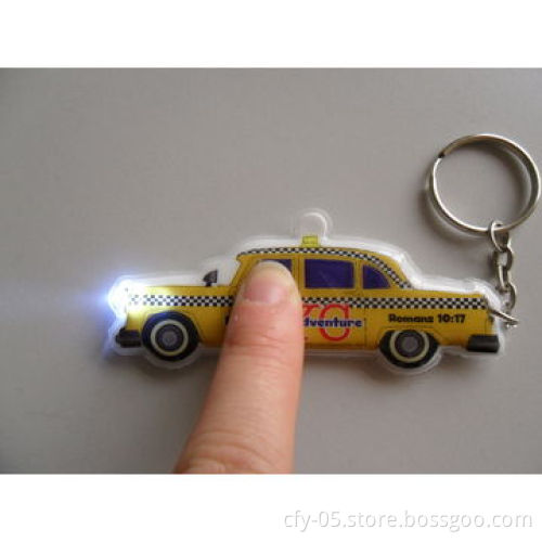 Supply plastic novelty LED promotional projection keyring torch light with customized logo